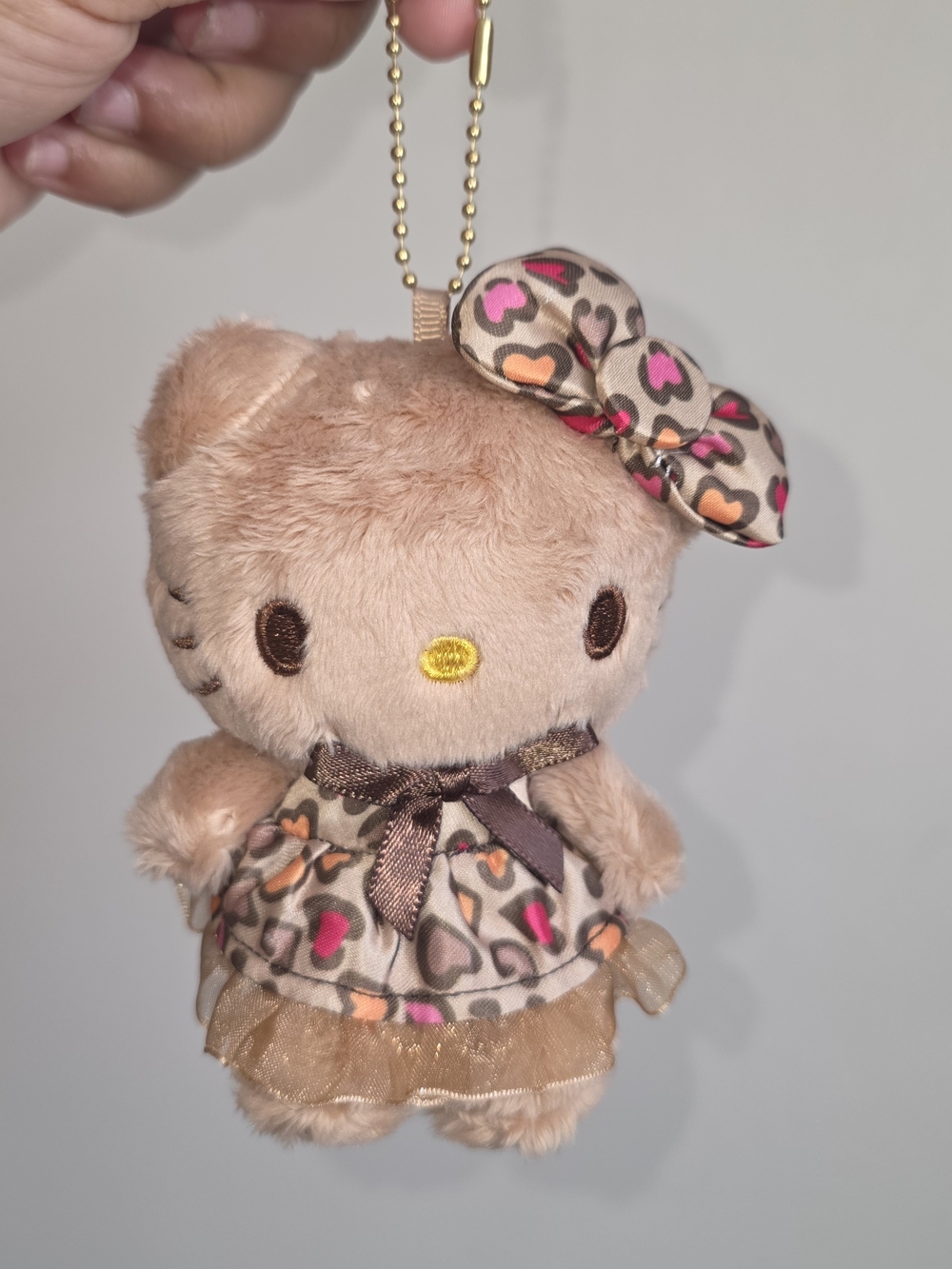 Sanrio Brown Hello Kitty Plush Keychain with Pink and Orange Hearts